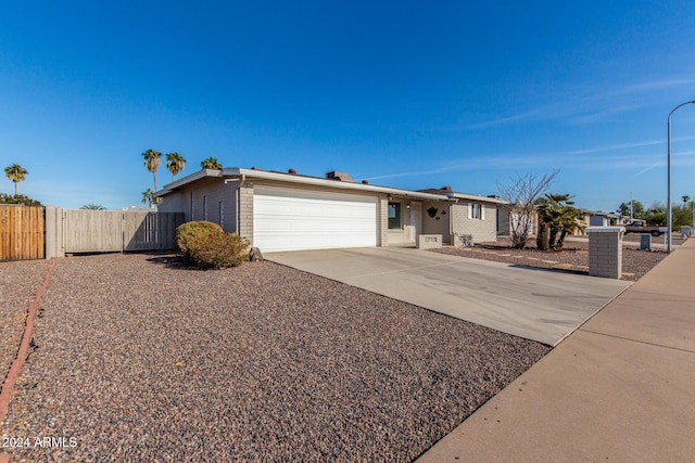 ranch-style house featuring a garage