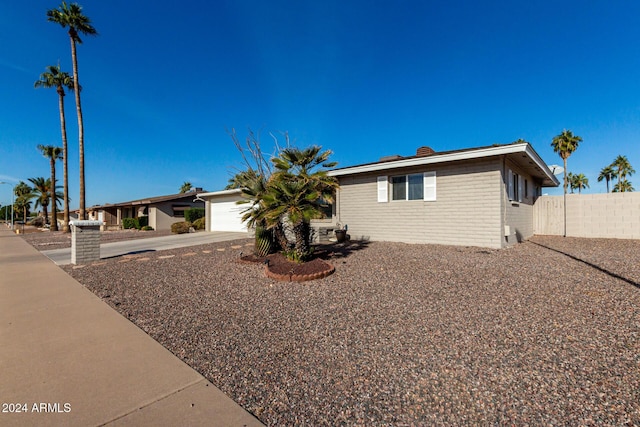 single story home featuring a garage