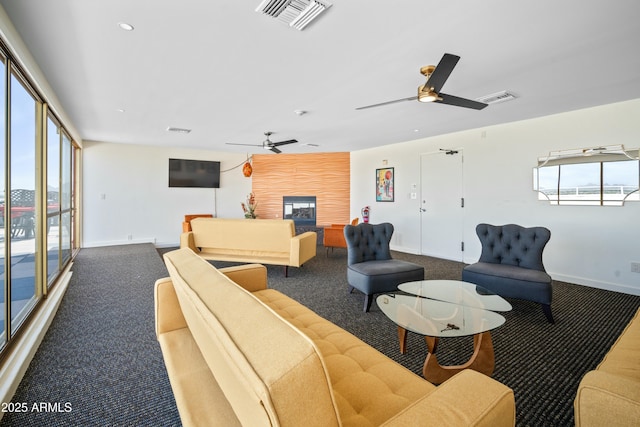 interior space featuring a wealth of natural light, a fireplace, and visible vents