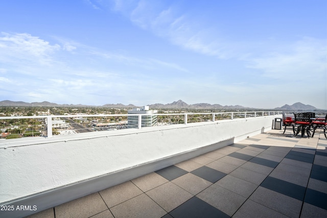 balcony featuring a patio area and a mountain view