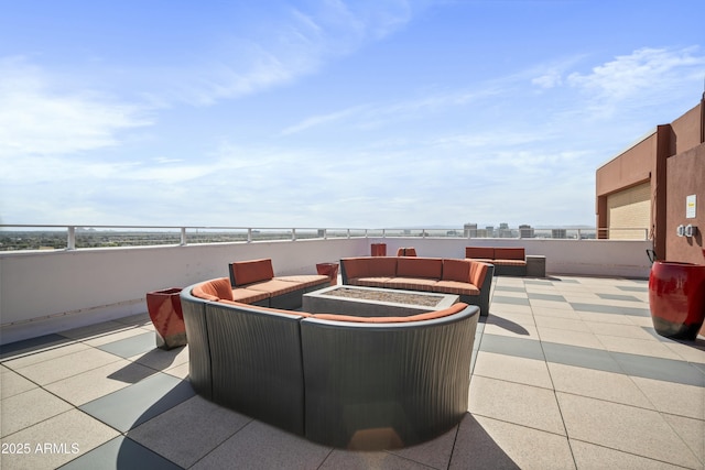 view of patio / terrace featuring an outdoor living space with a fire pit