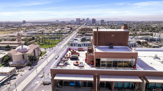 drone / aerial view featuring a city view