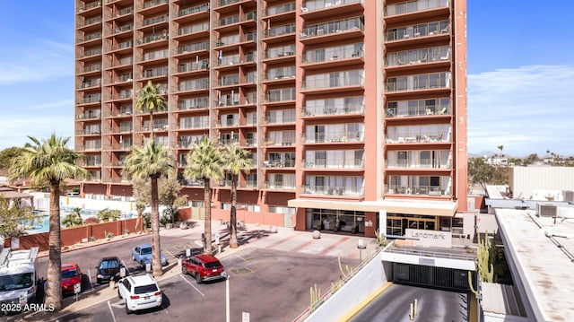view of property featuring uncovered parking