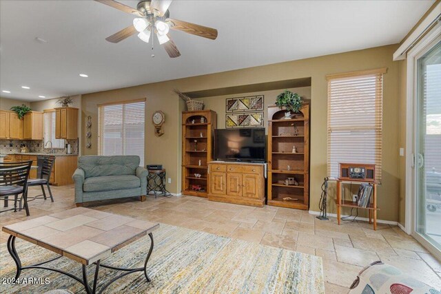 living room featuring ceiling fan