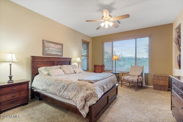 carpeted bedroom featuring ceiling fan