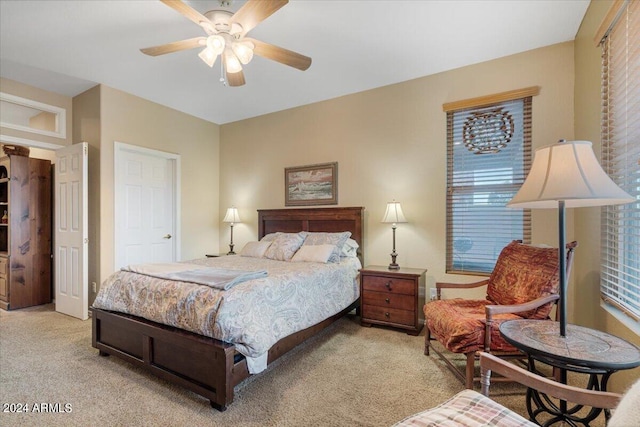 bedroom with light colored carpet and ceiling fan