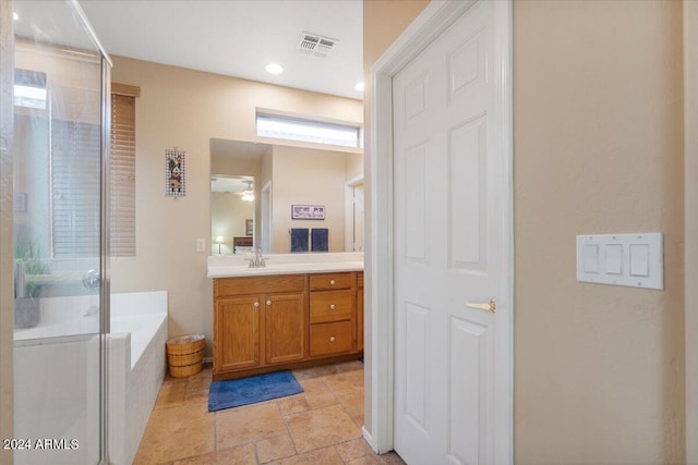 bathroom with vanity, ceiling fan, and shower with separate bathtub