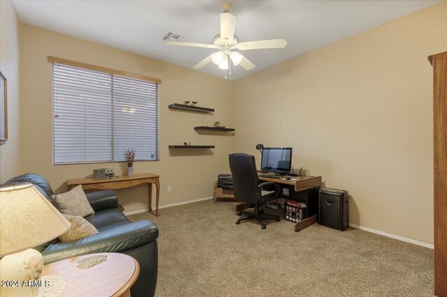 office space with ceiling fan and light colored carpet