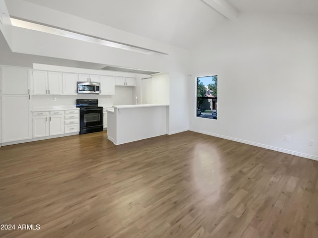 unfurnished living room with lofted ceiling with beams and dark hardwood / wood-style flooring