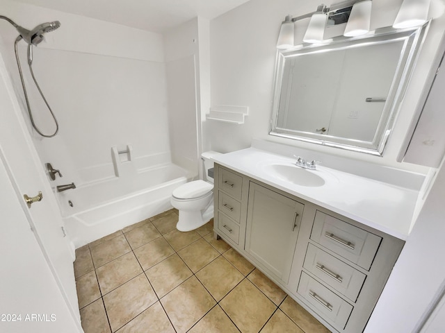 full bathroom with toilet, vanity, tile patterned floors, and shower / washtub combination