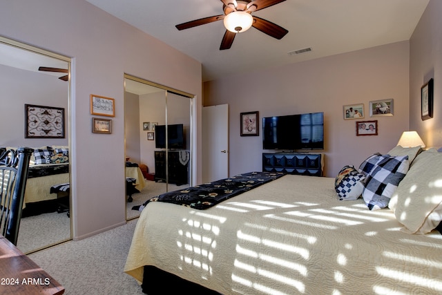 carpeted bedroom with ceiling fan and a closet