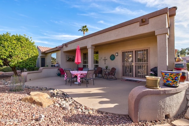 rear view of house featuring a patio area