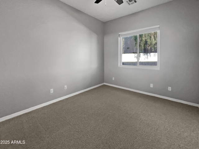 unfurnished room featuring ceiling fan and carpet flooring