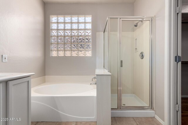 9511 E Kiva Ave, Mesa, AZ 85209 - full bath with a stall shower, a garden tub, tile patterned flooring, and vanity