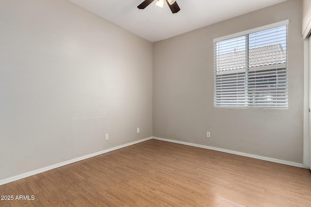 9511 E Kiva Ave, Mesa, AZ 85209 - spare room featuring light wood-type flooring, a ceiling fan, and baseboards