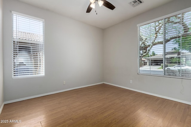 9511 E Kiva Ave, Mesa, AZ 85209 - empty room with wood finished floors, baseboards, and ceiling fan