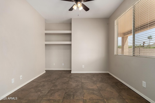 9511 E Kiva Ave, Mesa, AZ 85209 - tiled spare room featuring a ceiling fan and baseboards