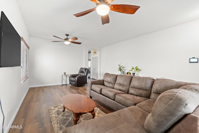 living room with dark hardwood / wood-style flooring