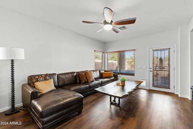 living room with a wealth of natural light, ceiling fan, and dark hardwood / wood-style floors