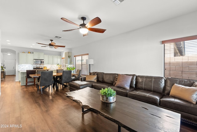 living room with hardwood / wood-style flooring and ceiling fan