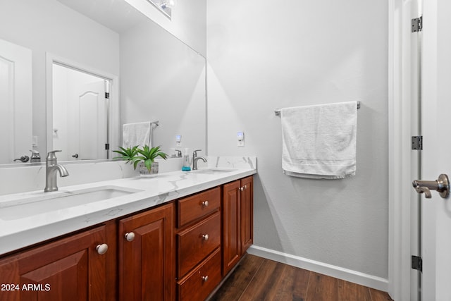 bathroom featuring hardwood / wood-style floors and vanity