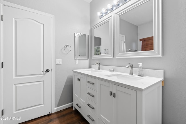 bathroom with vanity and wood-type flooring