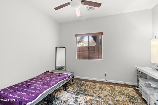 bedroom with ceiling fan and hardwood / wood-style flooring