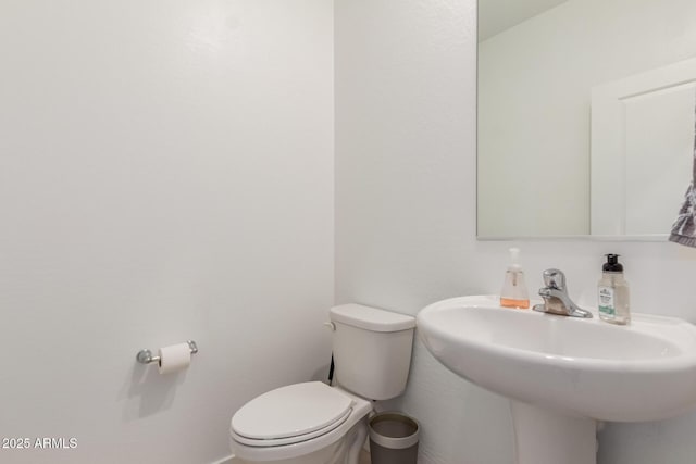 bathroom with sink and toilet