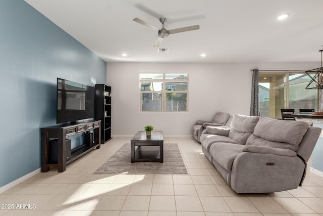 living room with ceiling fan and light tile patterned flooring