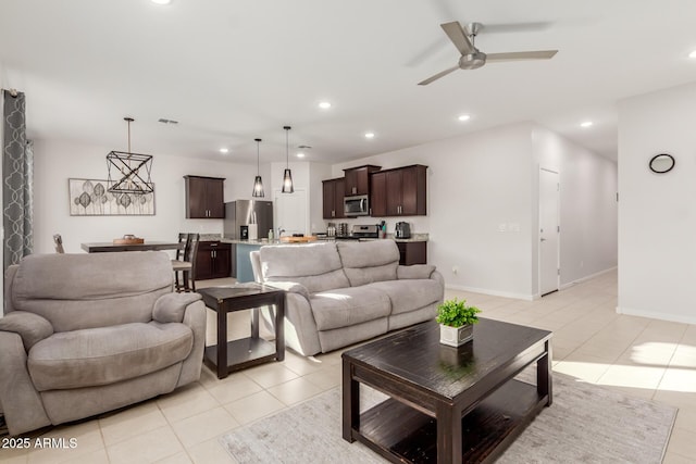 tiled living room with ceiling fan