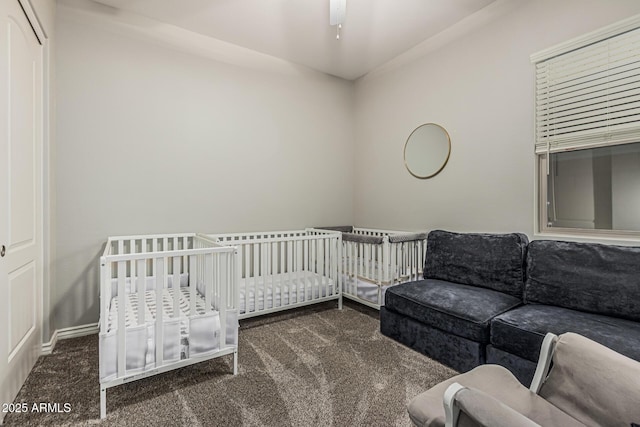 carpeted bedroom featuring baseboards
