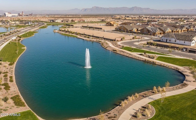 aerial perspective of suburban area featuring a water and mountain view