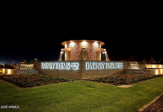 community / neighborhood sign with a lawn