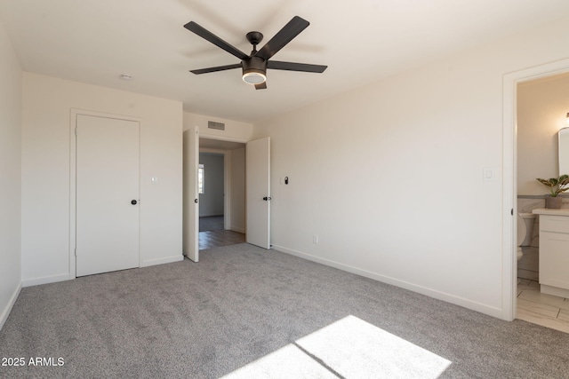 3118 S Los Altos Dr, Mesa, AZ 85202 - unfurnished bedroom featuring light colored carpet, baseboards, and connected bathroom