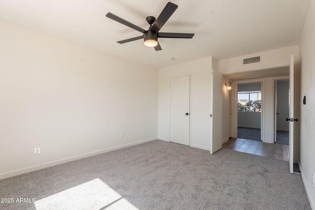 3118 S Los Altos Dr, Mesa, AZ 85202 - unfurnished bedroom featuring carpet flooring, baseboards, and a ceiling fan