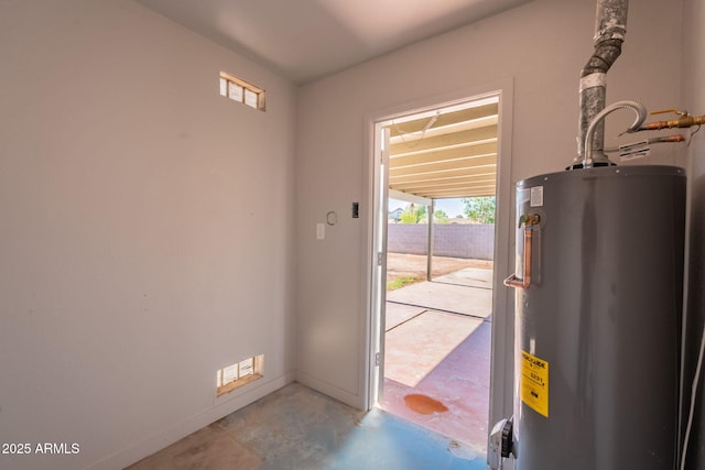 3118 S Los Altos Dr, Mesa, AZ 85202 - doorway with water heater, concrete floors, and plenty of natural light