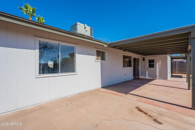 3118 S Los Altos Dr, Mesa, AZ 85202 - view of patio / terrace with driveway, an attached carport, and central AC unit