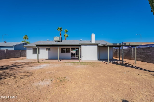 3118 S Los Altos Dr, Mesa, AZ 85202 - rear view of house featuring a patio, a fenced backyard, central air condition unit, and a chimney