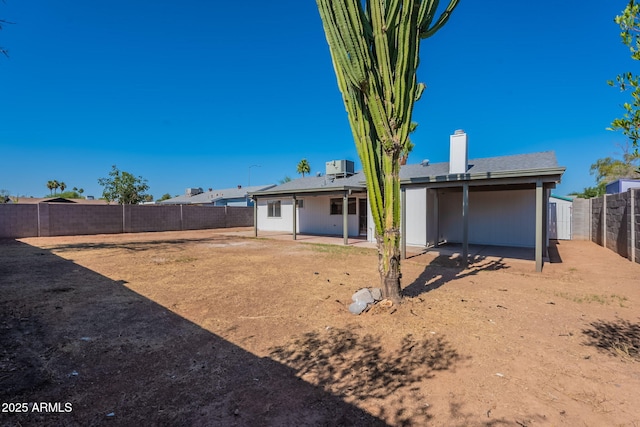 3118 S Los Altos Dr, Mesa, AZ 85202 - back of house featuring a fenced backyard, a patio area, a chimney, and central air condition unit