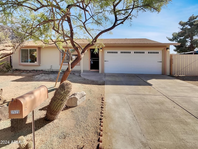 single story home with a garage