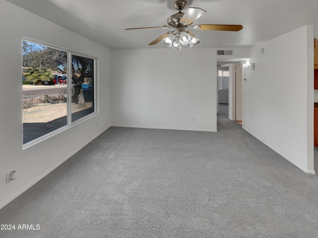 spare room with ceiling fan and carpet floors