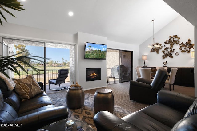 living room with carpet and high vaulted ceiling