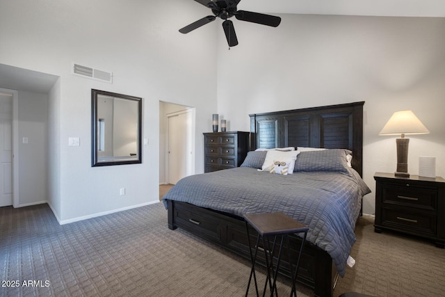 carpeted bedroom featuring a high ceiling and ceiling fan