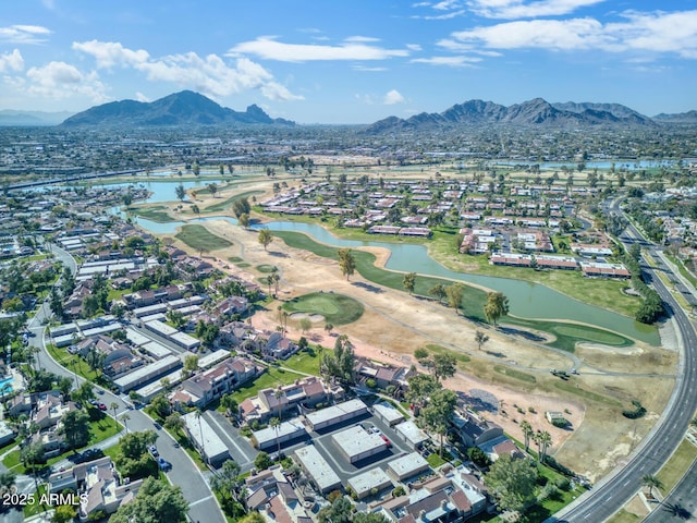 aerial view featuring a water and mountain view