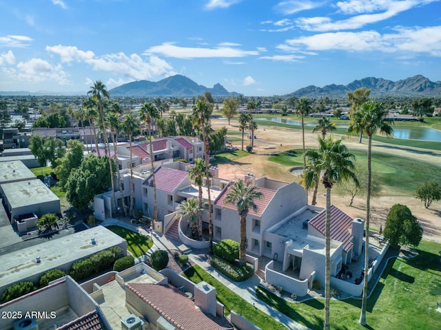 drone / aerial view with a water and mountain view