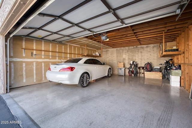 garage featuring a garage door opener and a carport