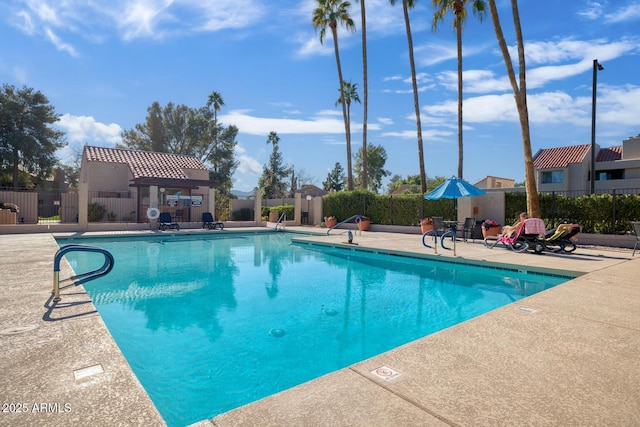 view of swimming pool featuring a patio area