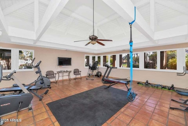 workout room with tile patterned flooring, vaulted ceiling, and a wealth of natural light