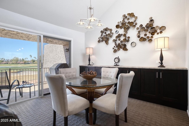 dining room with lofted ceiling and carpet flooring