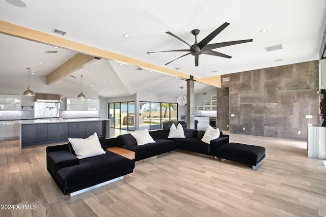 living room featuring vaulted ceiling with beams, ceiling fan, tile walls, and light hardwood / wood-style floors